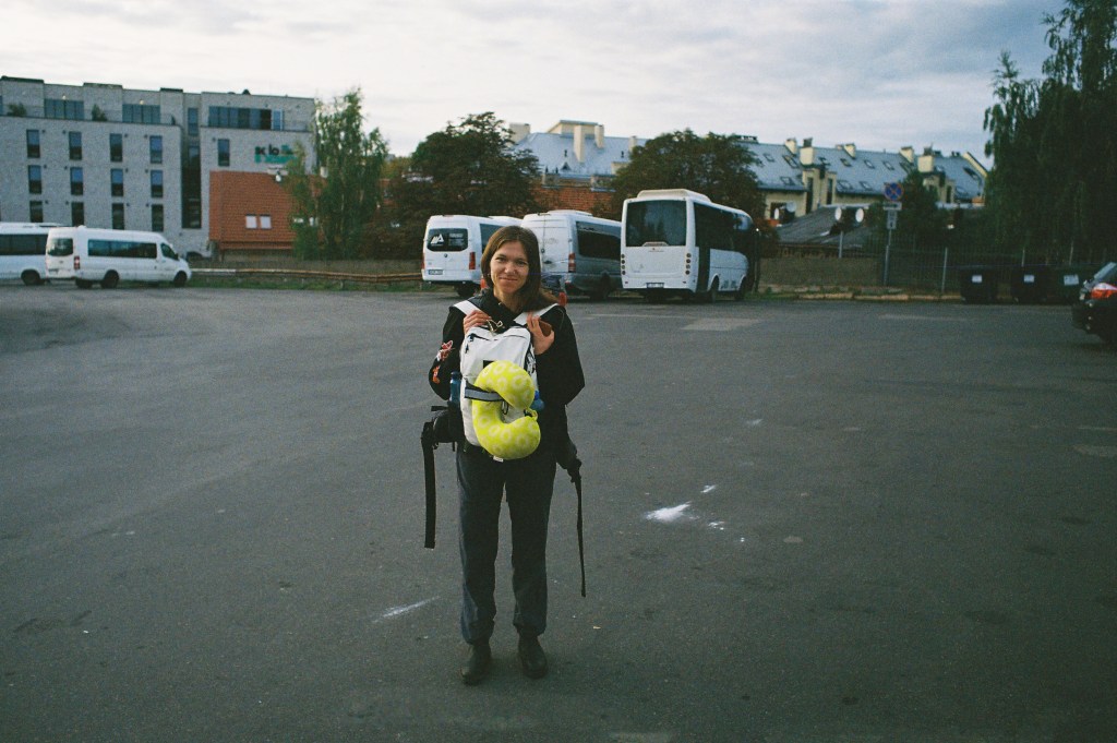 Woman returning home from long bus ride at bus station